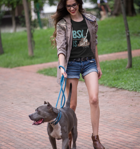 pretty-woman-walking-the-dog-wearing-a-t-shirt-mockup-at-the-park-a17354.png